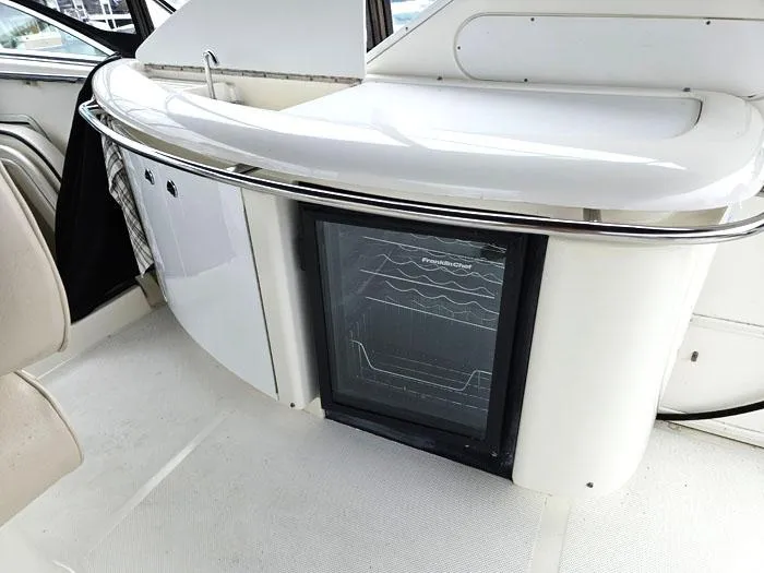  Yacht Photos Pics Interior of 2000 Bayliner 5288 Pilot House Motoryacht with built-in mini fridge.