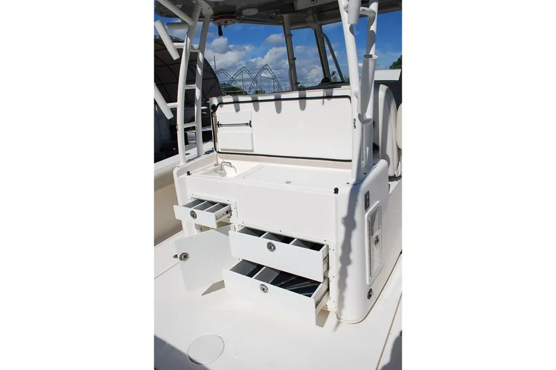 Playin Hooky Yacht Photos Pics 2019 Cobia 344 Center Console boat interior with open storage drawers.