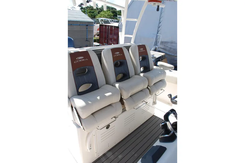 Playin Hooky Yacht Photos Pics 2019 Cobia 344 Center Console boat with three cushioned seats.