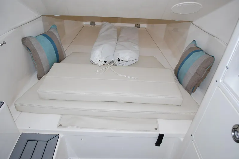 Playin Hooky Yacht Photos Pics 2019 Cobia 344 Center Console cabin interior with cushions and pillows.