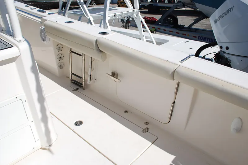 Playin Hooky Yacht Photos Pics 2019 Cobia 344 Center Console boat interior with seating and Mercury engine.
