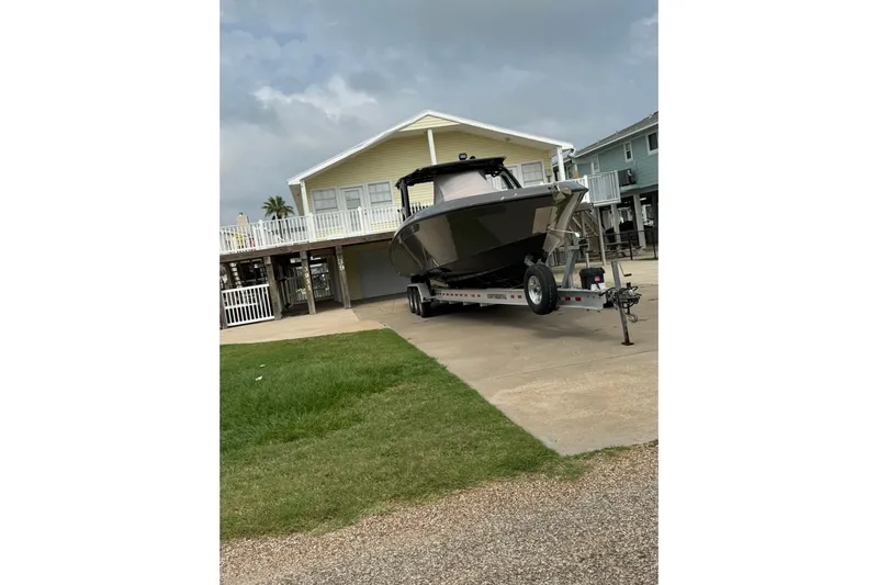  Yacht Photos Pics 2020 Midnight Express 37 Center Console boat on trailer in driveway.