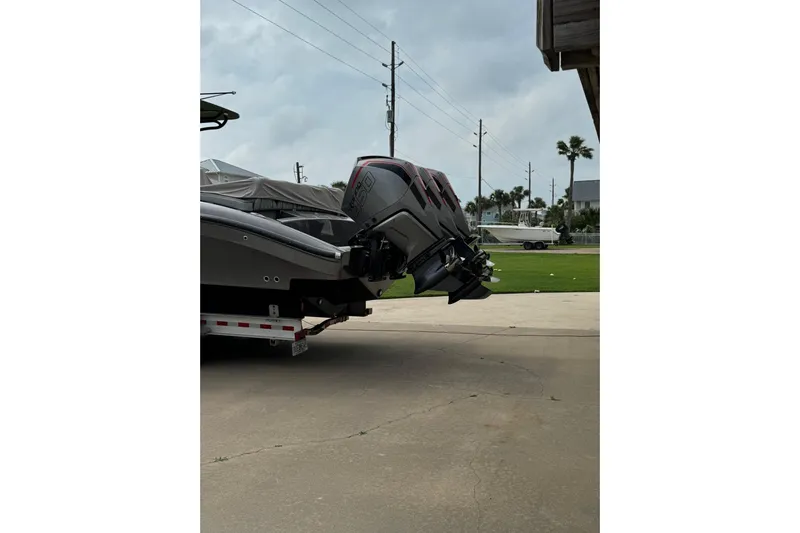  Yacht Photos Pics 2020 Midnight Express 37 Center Console boat on trailer, featuring powerful outboard engines.