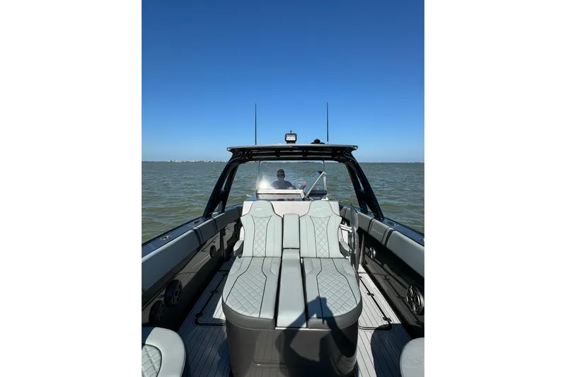  Yacht Photos Pics 2020 Midnight Express 37 Center Console boat on open water, clear blue sky.