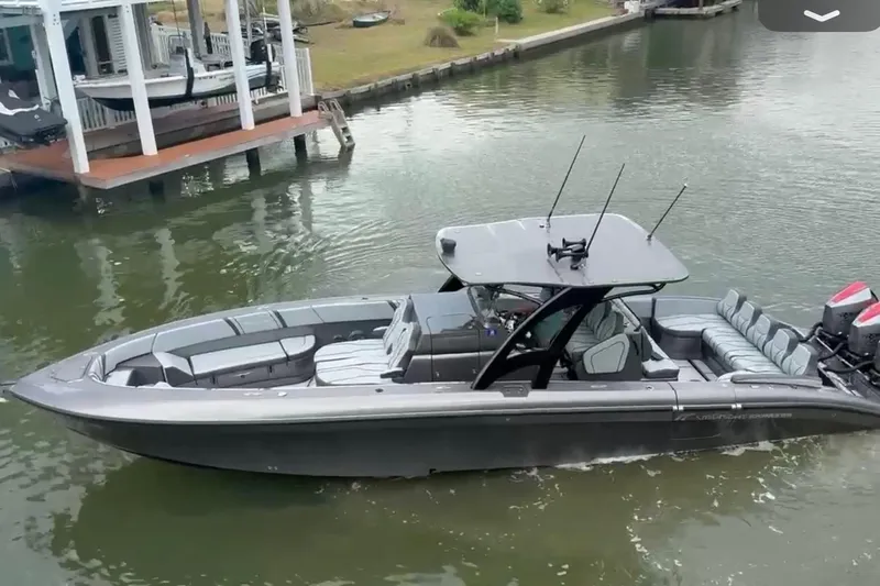  Yacht Photos Pics 2020 Midnight Express 37 Center Console boat cruising on a calm waterway.