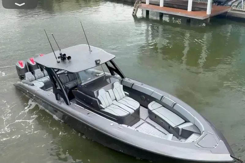  Yacht Photos Pics 2020 Midnight Express 37 Center Console boat on water, featuring sleek design and spacious seating.