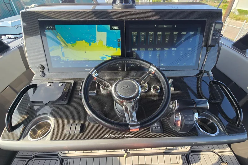  Yacht Photos Pics Cockpit of 2020 Midnight Express 37 Center Console with dual navigation screens and steering wheel.