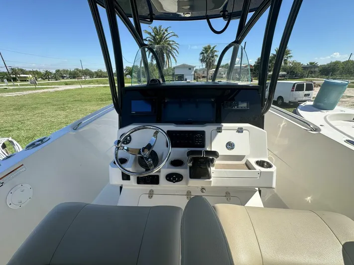  Yacht Photos Pics 2021 Sailfish 29 Center Console boat interior with steering wheel and dashboard.