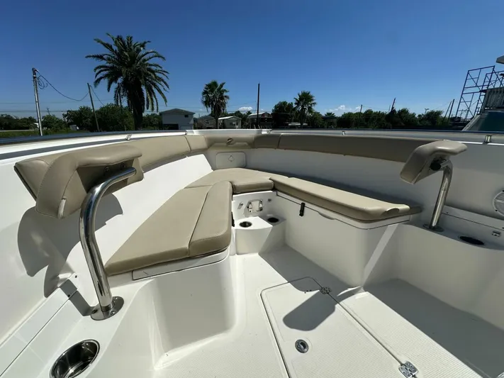  Yacht Photos Pics 2021 Sailfish 29 Center Console boat interior with cushioned seating and cup holders.