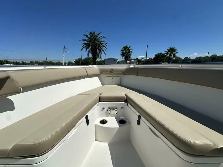  Yacht Photos Pics 2021 Sailfish 29 Center Console boat interior with beige seating and cup holders.