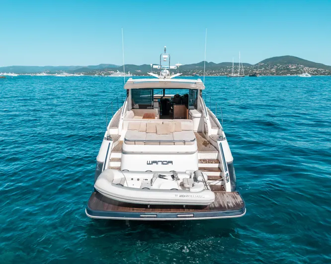  Yacht Photos Pics Luxury 2011 Princess V62 yacht on clear blue water, rear view.