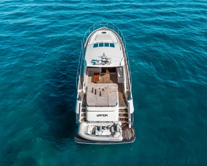  Yacht Photos Pics Luxury 2011 Princess V62 yacht on clear blue ocean waters, aerial view.