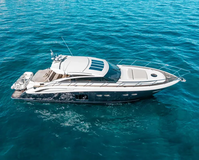  Yacht Photos Pics 2011 Princess V62 yacht cruising on clear blue ocean waters.