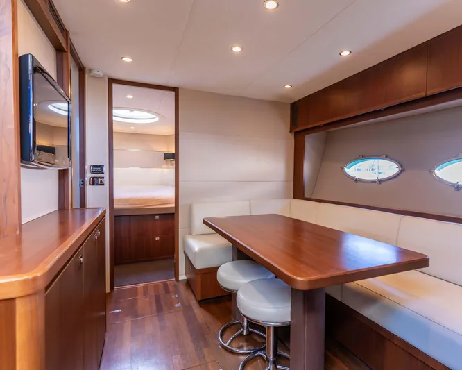  Yacht Photos Pics Luxurious interior of 2011 Princess V62 yacht with elegant dining area and modern furnishings.