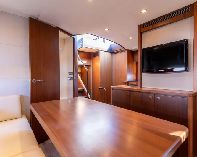  Yacht Photos Pics Luxurious interior of 2011 Princess V62 yacht with wooden furnishings and modern amenities.