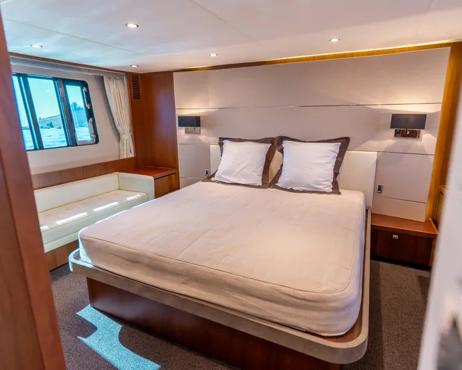  Yacht Photos Pics Luxurious bedroom interior of 2011 Princess V62 yacht with elegant furnishings.