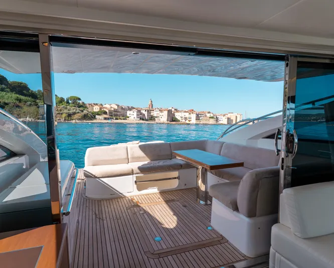  Yacht Photos Pics Luxurious 2011 Princess V62 yacht interior with scenic coastal view.