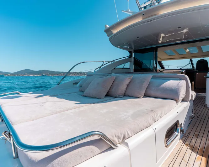  Yacht Photos Pics Luxurious 2011 Princess V62 yacht with spacious sunbed and scenic ocean view.