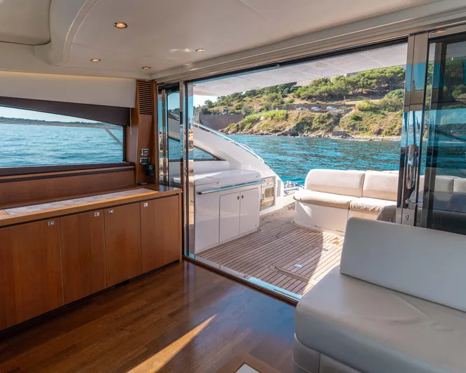  Yacht Photos Pics Luxurious interior of 2011 Princess V62 yacht with ocean view and elegant furnishings.
