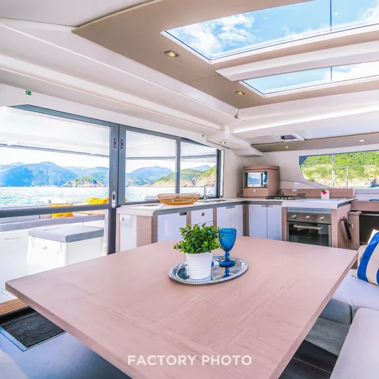 Bonova Yacht Photos Pics Luxurious interior of 2022 Fountaine Pajot Tanna 47 catamaran with panoramic ocean views.