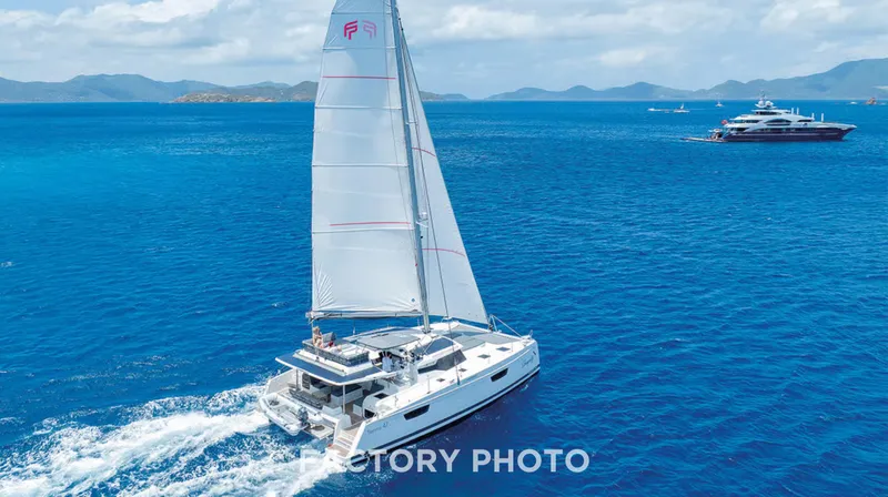 Bonova Yacht Photos Pics Sailing catamaran Fountaine Pajot Tanna 47, 2022 model, cruising in clear blue ocean.