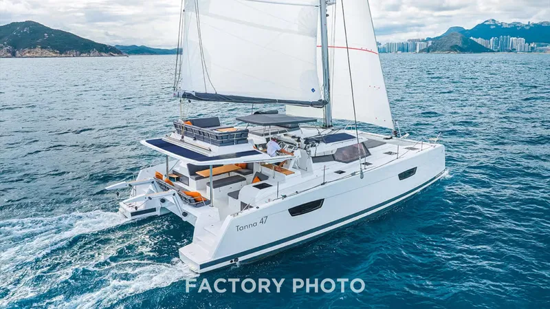 Bonova Yacht Photos Pics 2022 Fountaine Pajot Tanna 47 catamaran sailing on open water.