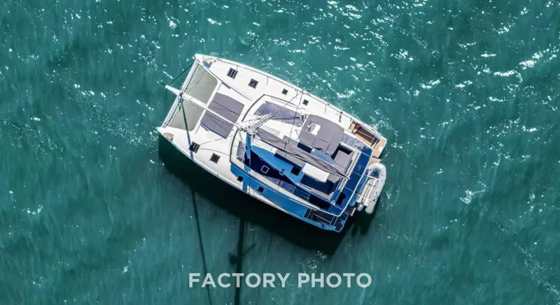 Bonova Yacht Photos Pics Aerial view of 2022 Fountaine Pajot Tanna 47 catamaran on turquoise water.