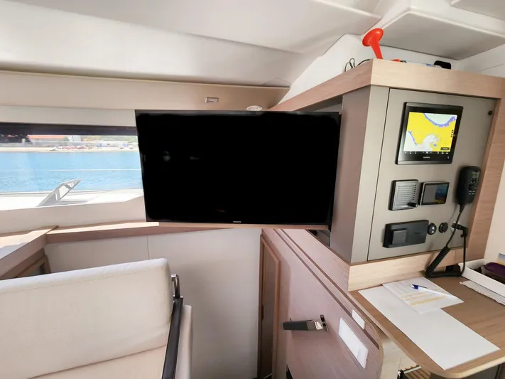 Bonova Yacht Photos Pics Interior of 2022 Fountaine Pajot Tanna 47 yacht with navigation equipment and TV.