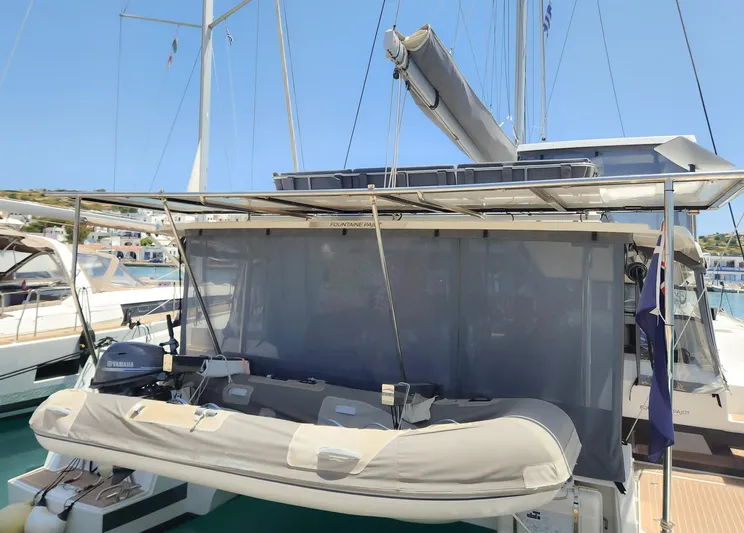 Bonova Yacht Photos Pics 2022 Fountaine Pajot Tanna 47 catamaran with dinghy and Yamaha motor at marina.
