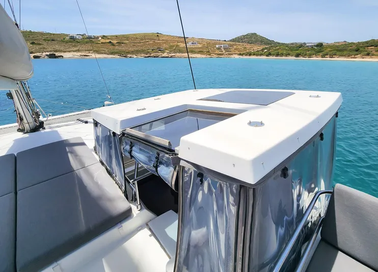 Bonova Yacht Photos Pics Fountaine Pajot Tanna 47 catamaran, 2022 model, anchored in serene blue waters.