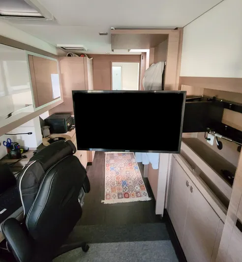 Bonova Yacht Photos Pics Interior of 2022 Fountaine Pajot Tanna 47 yacht with modern furnishings and TV.