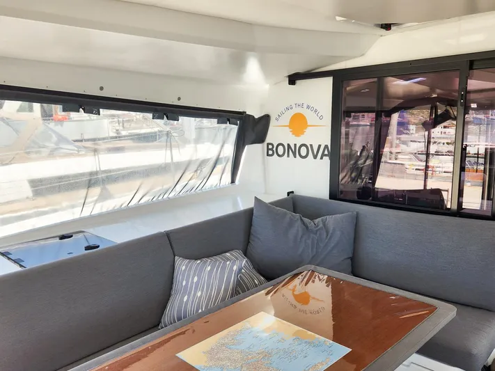 Bonova Yacht Photos Pics Interior of 2022 Fountaine Pajot Tanna 47 yacht with cozy seating and map.