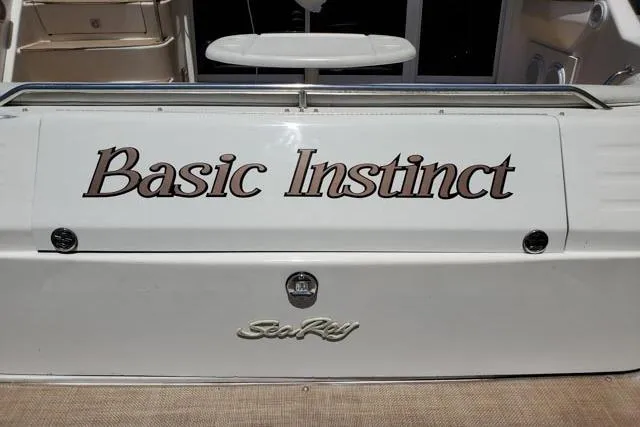 Basic Instinct Yacht Photos Pics 1995 Sea Ray 440 Express Bridge boat with "Basic Instinct" name on the stern.