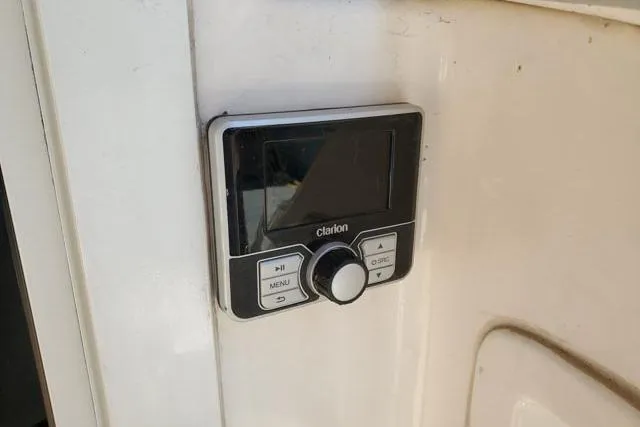 Basic Instinct Yacht Photos Pics Clarion audio control panel on 1995 Sea Ray 440 Express Bridge yacht.