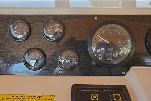 Basic Instinct Yacht Photos Pics Dashboard of a 1995 Sea Ray 440 Express Bridge with gauges and controls.