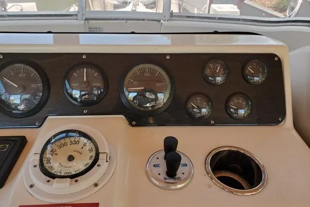 Basic Instinct Yacht Photos Pics 1995 Sea Ray 440 Express Bridge dashboard with gauges and controls.