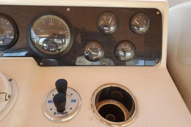 Basic Instinct Yacht Photos Pics Dashboard of 1995 Sea Ray 440 Express Bridge with gauges and controls.