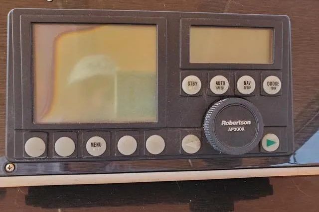 Basic Instinct Yacht Photos Pics Control panel of a 1995 Sea Ray 440 Express Bridge with Robertson AP300X autopilot.