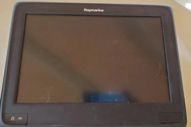 Basic Instinct Yacht Photos Pics Raymarine marine display screen on 1995 Sea Ray 440 Express Bridge.