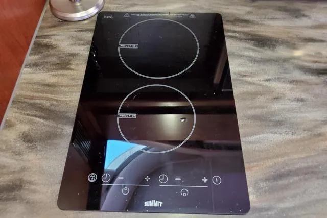 Basic Instinct Yacht Photos Pics Modern electric cooktop on Sea Ray 440 Express Bridge yacht, 1995 model.