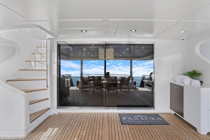 Panacea Yacht Photos Pics Luxurious 2011 Mengi Yay 115 MY yacht interior with ocean view and elegant staircase.