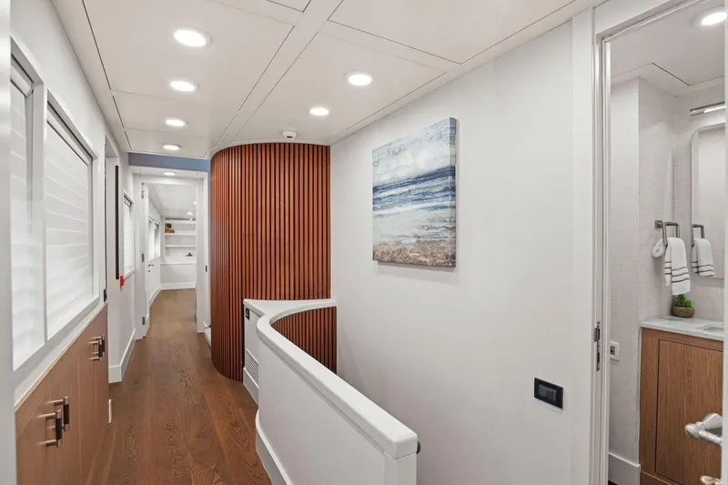 Panacea Yacht Photos Pics Luxurious hallway on 2011 Mengi Yay 115 MY yacht with modern decor and artwork.