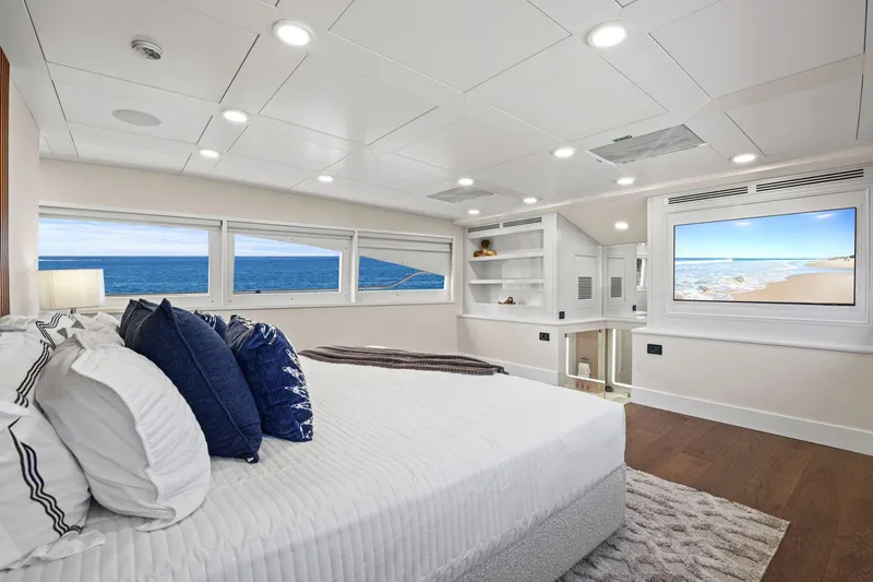 Panacea Yacht Photos Pics Luxurious bedroom interior on 2011 Mengi Yay 115 MY yacht with ocean view windows.