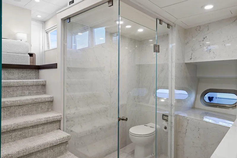 Panacea Yacht Photos Pics Luxurious bathroom on 2011 Mengi Yay 115 MY yacht with marble walls and modern fixtures.