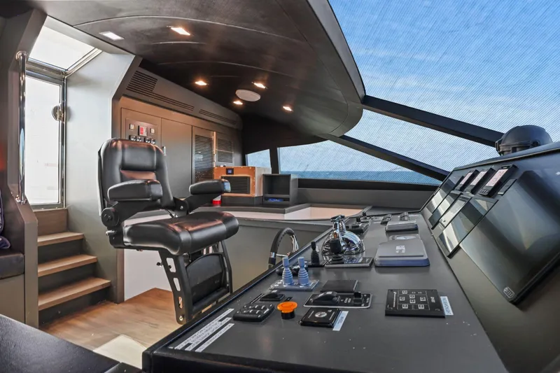 Panacea Yacht Photos Pics Luxurious helm of 2011 Mengi Yay 115 MY yacht with modern controls and captain's chair.