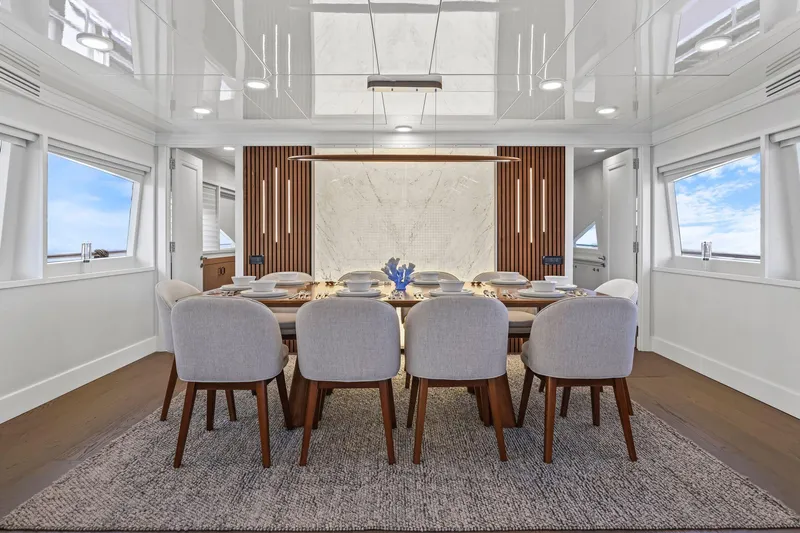Panacea Yacht Photos Pics Luxurious dining area on 2011 Mengi Yay 115 MY yacht, featuring elegant decor and modern furnishings.