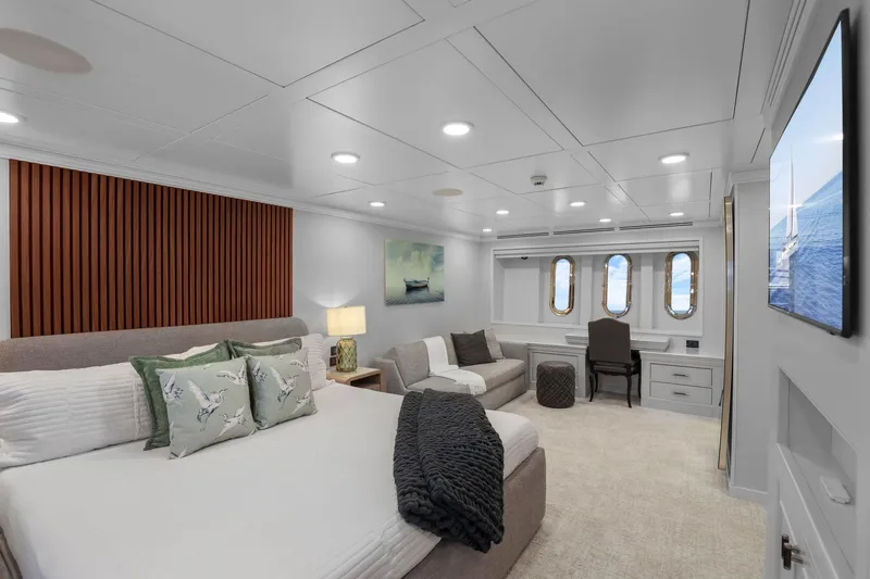 Panacea Yacht Photos Pics Luxurious bedroom interior of 2011 Mengi Yay 115 MY yacht with elegant decor and ocean view.