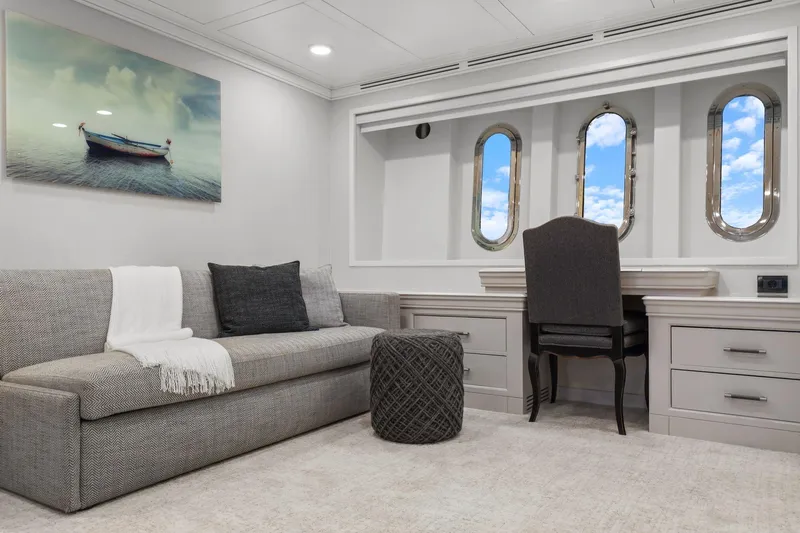 Panacea Yacht Photos Pics Luxurious interior of 2011 Mengi Yay 115 MY yacht with elegant seating and porthole windows.