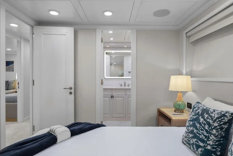 Panacea Yacht Photos Pics Luxurious bedroom interior on 2011 Mengi Yay 115 MY yacht, featuring elegant decor and ambient lighting.