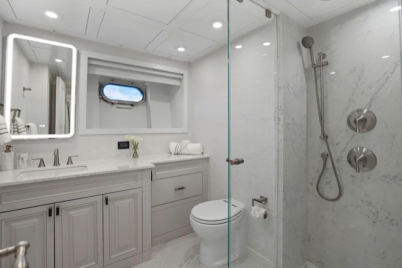 Panacea Yacht Photos Pics Luxurious yacht bathroom with marble shower, modern fixtures, and elegant vanity on Mengi Yay 115 MY.